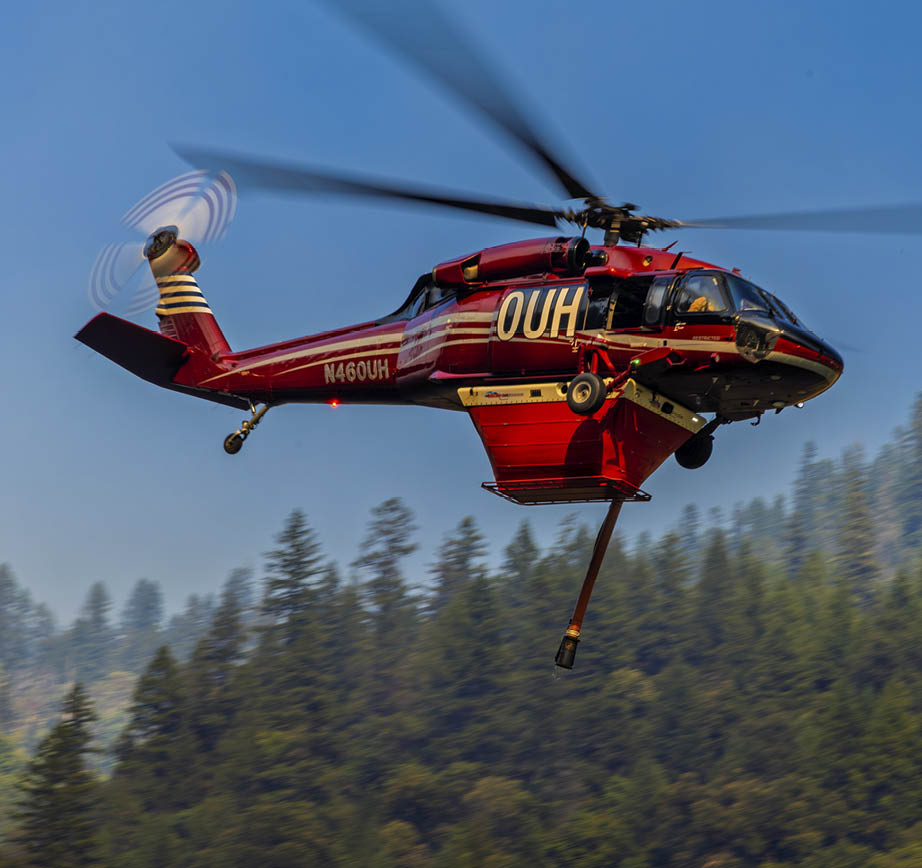 A red helicopter with the number 007 on it is flying through the sky. AI generated content