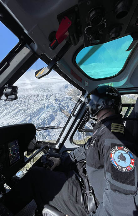 A man is sitting in a helicopter, looking out the window. AI generated content