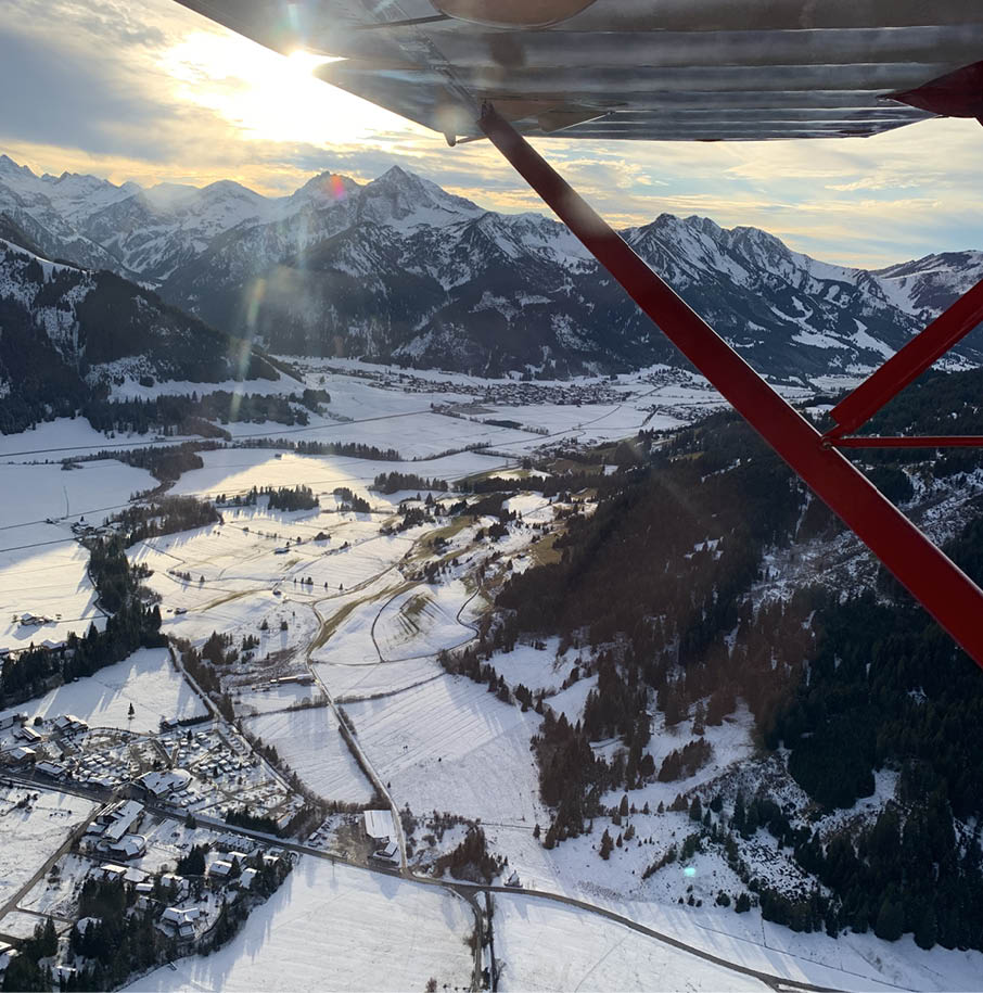 A mountain range is visible from a plane window. AI generated content