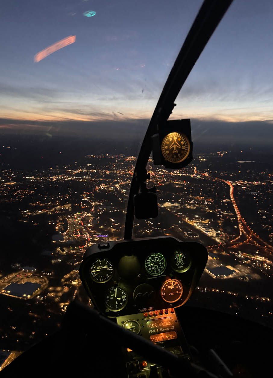 A cockpit view of a city at night with a clear sky. AI generated content