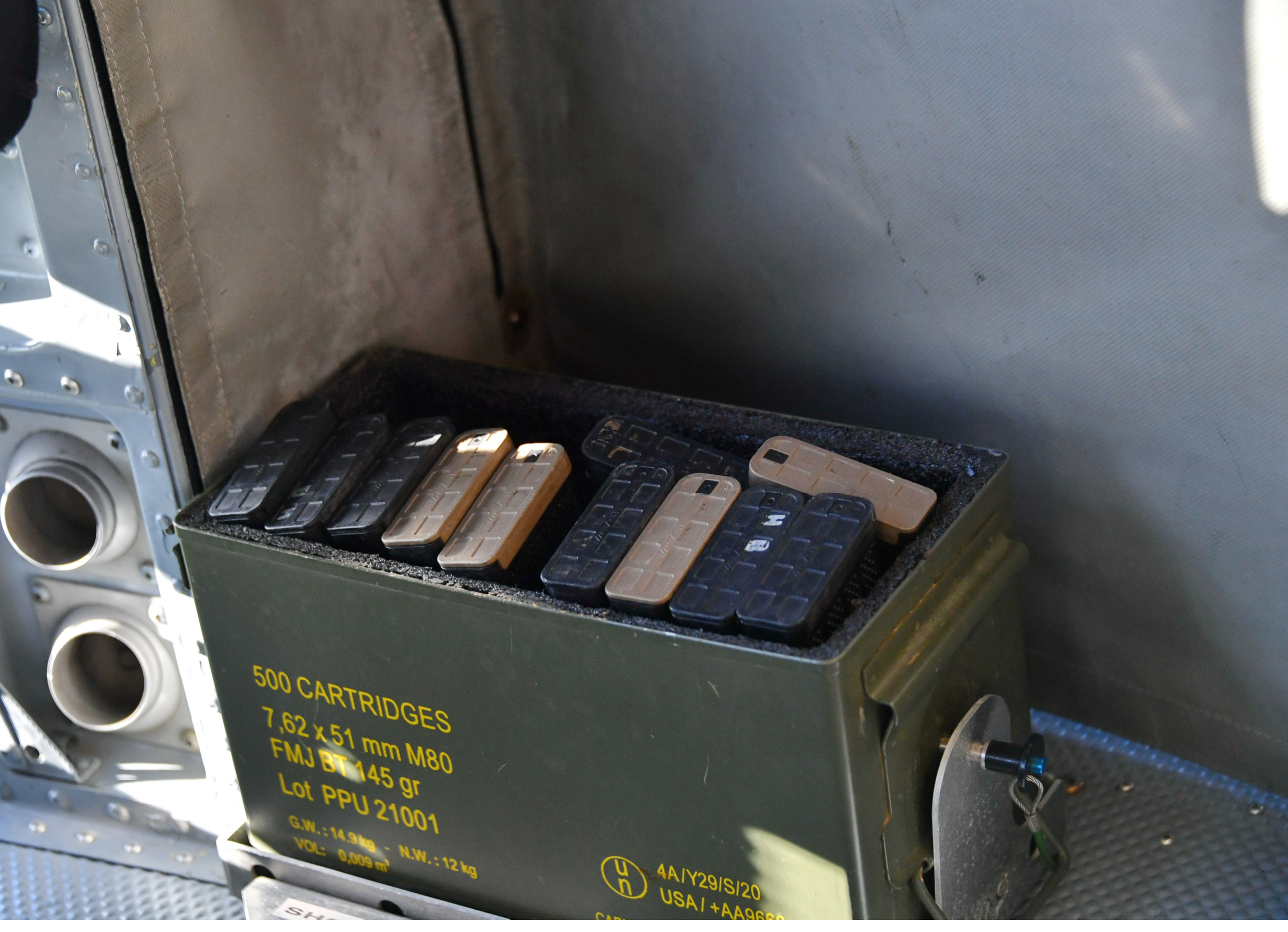 A green case with a black handle is on a table. AI generated content