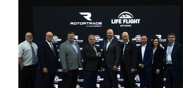 A group of men and women pose for a picture in front of a banner. AI generated content