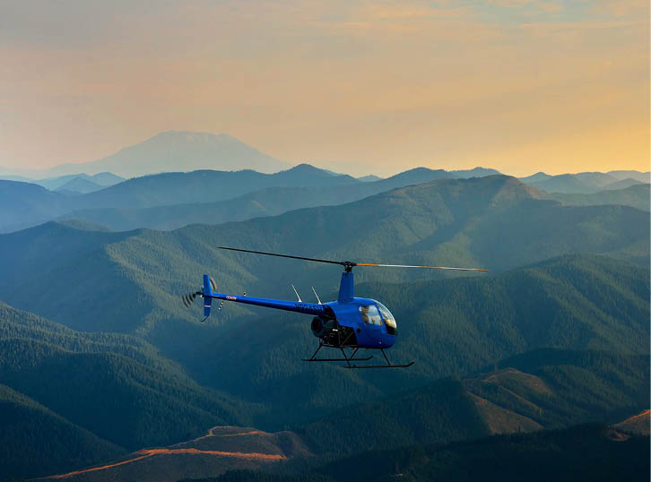 A blue helicopter is flying over a mountain range. AI generated content