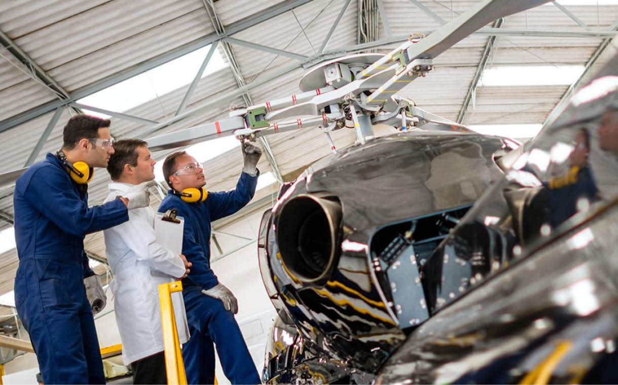 Two men are working on a helicopter in a hangar. AI generated content