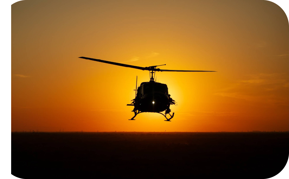A helicopter is flying in the sky with the sun in the background. AI generated content