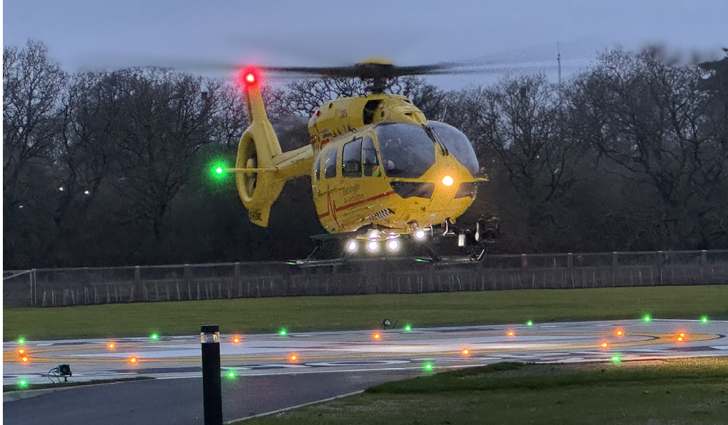 A yellow helicopter is on the ground with its landing gear down. AI generated content