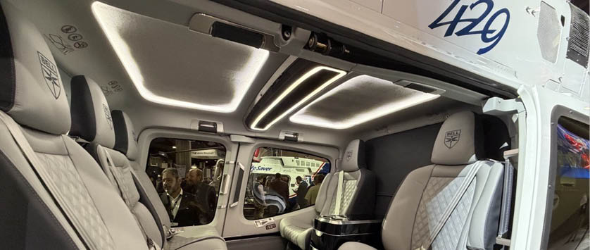 A helicopter with two seats, one on the left and one on the right, is shown from the inside. The seats are white and appear to be comfortable. AI generated content