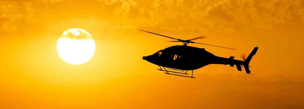 A helicopter is flying in the sky with the sun in the background. AI generated content