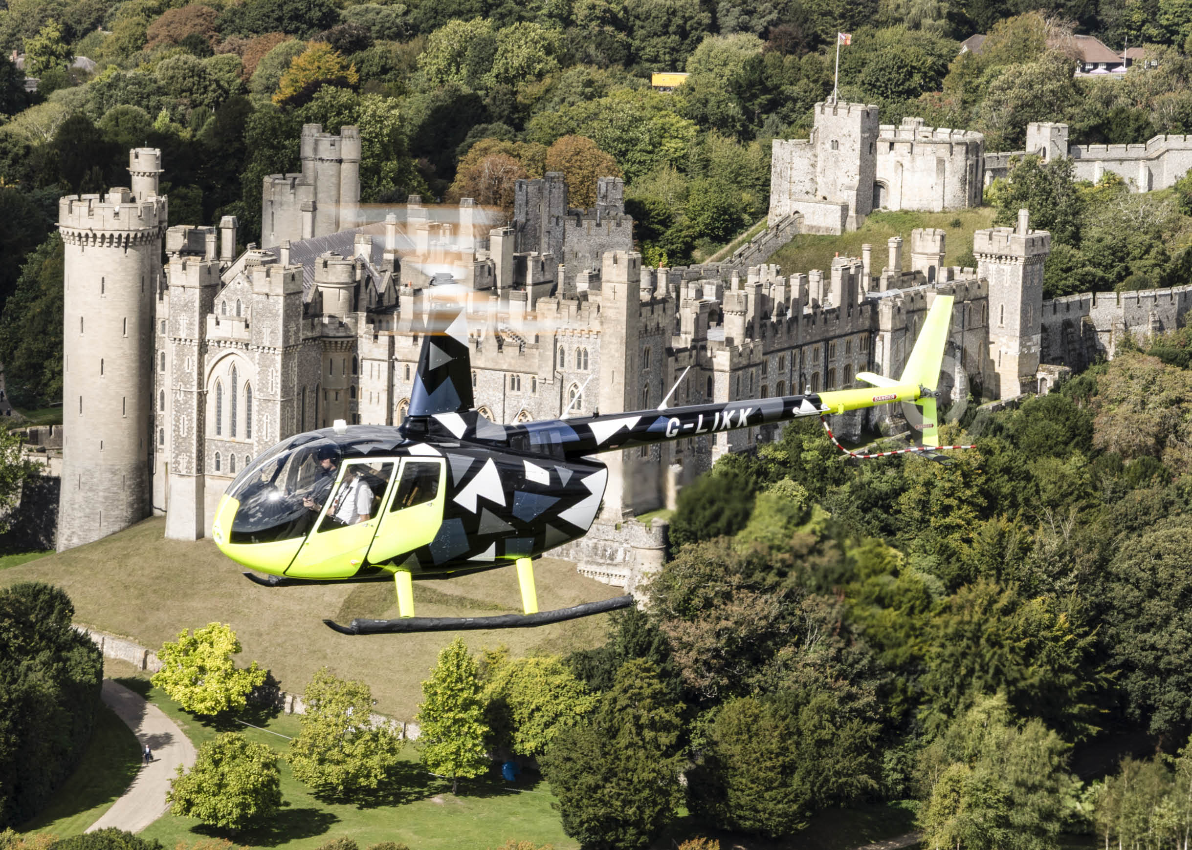 A yellow helicopter is flying over a castle. AI generated content