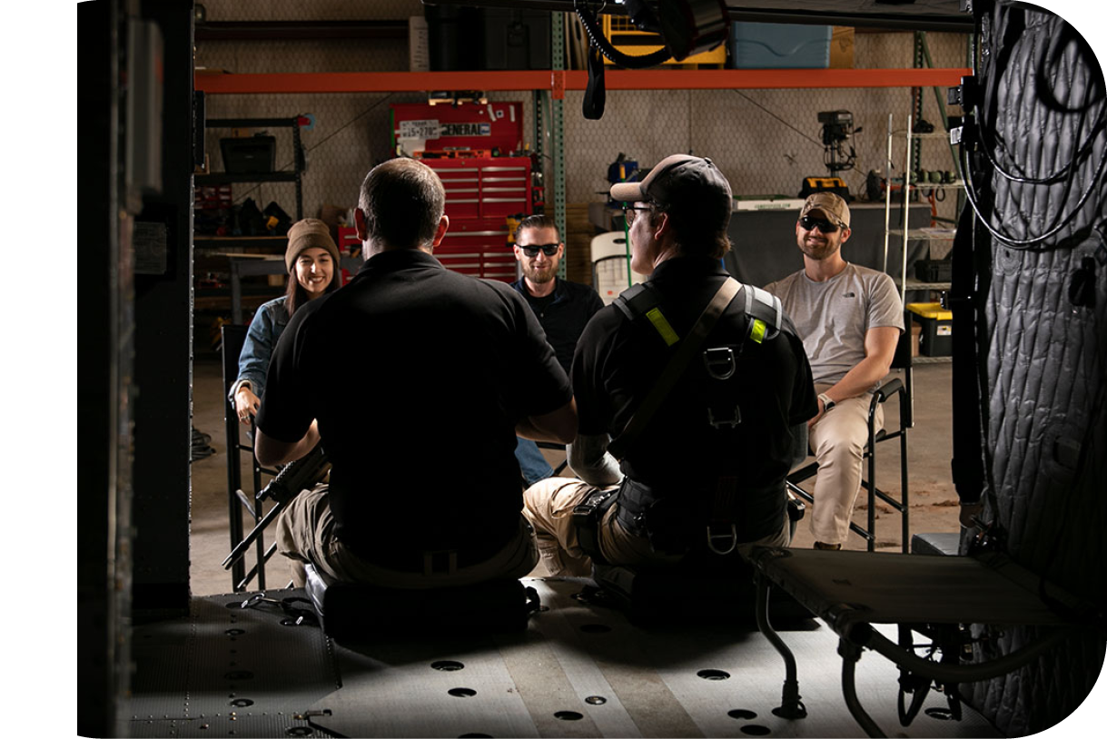 A group of people are sitting on the floor in a room. AI generated content