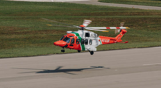 A red and white helicopter is flying low to the ground. AI generated content