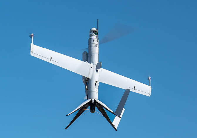 A small white plane with a propeller is flying in the sky. AI generated content