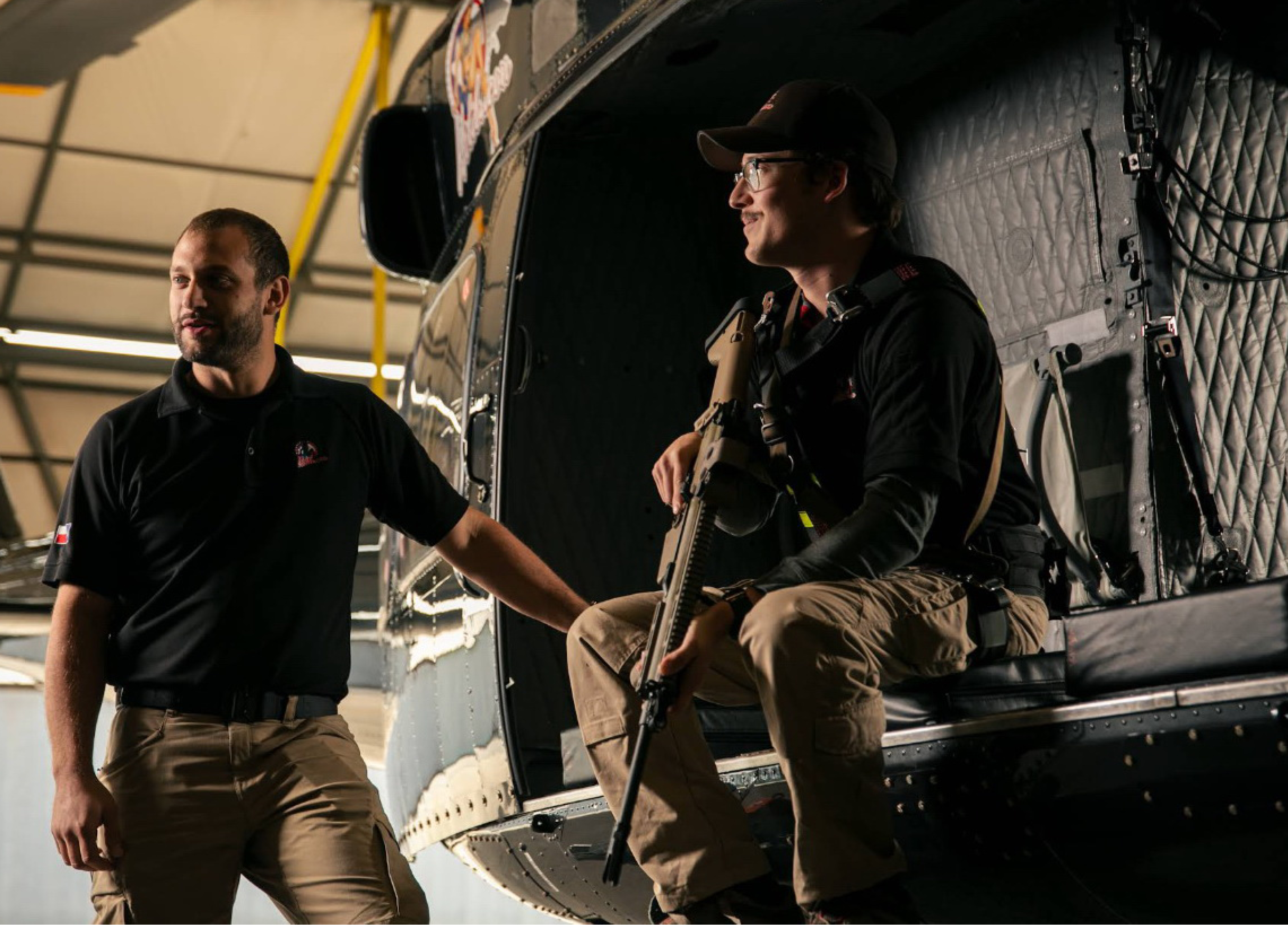 Two men are standing in front of a helicopter. AI generated content