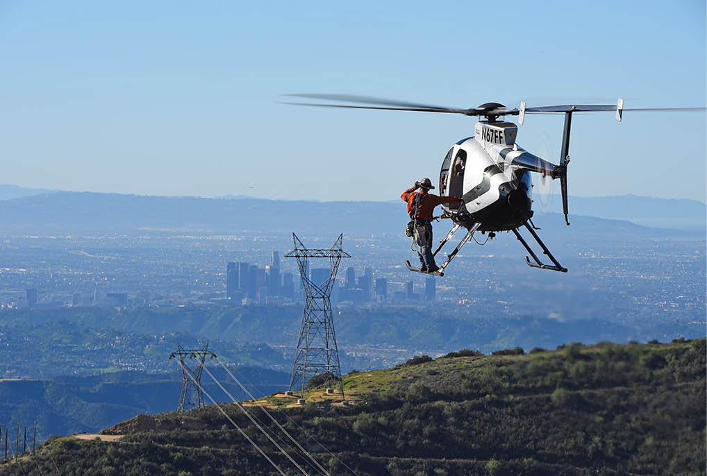A helicopter is flying over a city. Description generated by AI
