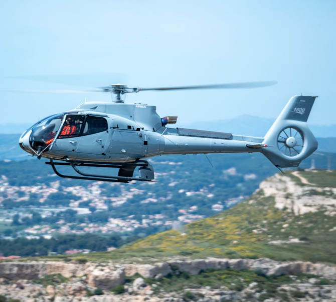 A helicopter flying in the sky. Description generated by AI