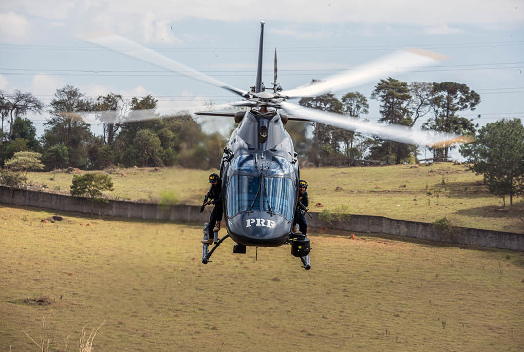 A helicopter is flying in the air. Description generated by AI