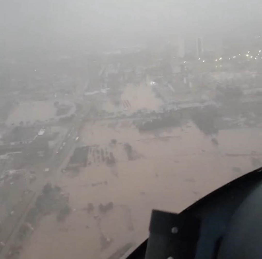 A city street with a flooded area. Description generated by AI