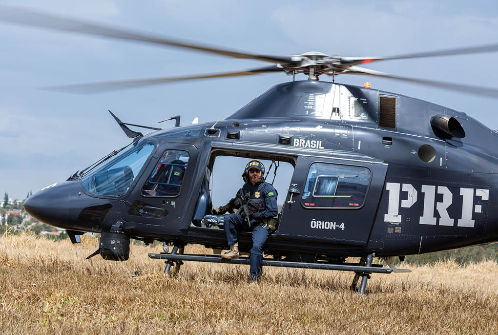 A helicopter with the letters PRF on the side. Description generated by AI