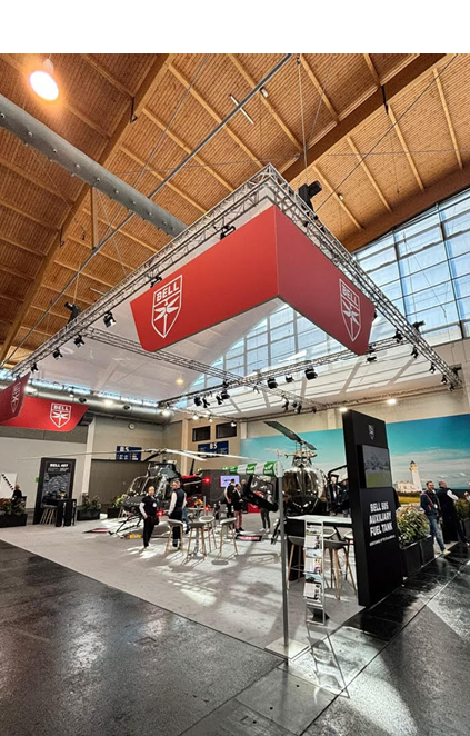 A large red and white sign hangs from the ceiling. Description generated by AI