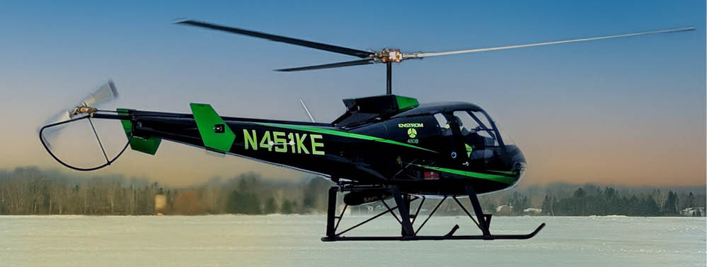 A green and black helicopter with the number 54 on it. Description generated by AI