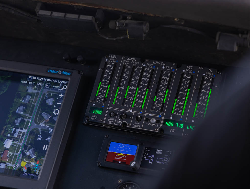 A cockpit of a plane with a green screen. Description generated by AI
