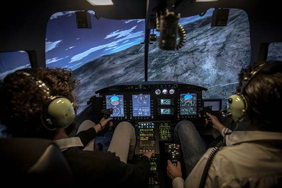 Two men in a cockpit of a plane. Description generated by AI
