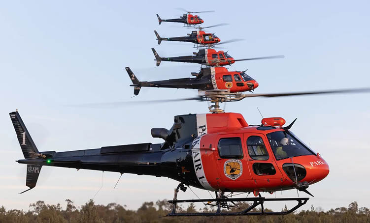 A helicopter with a red and black color scheme. Description generated by AI