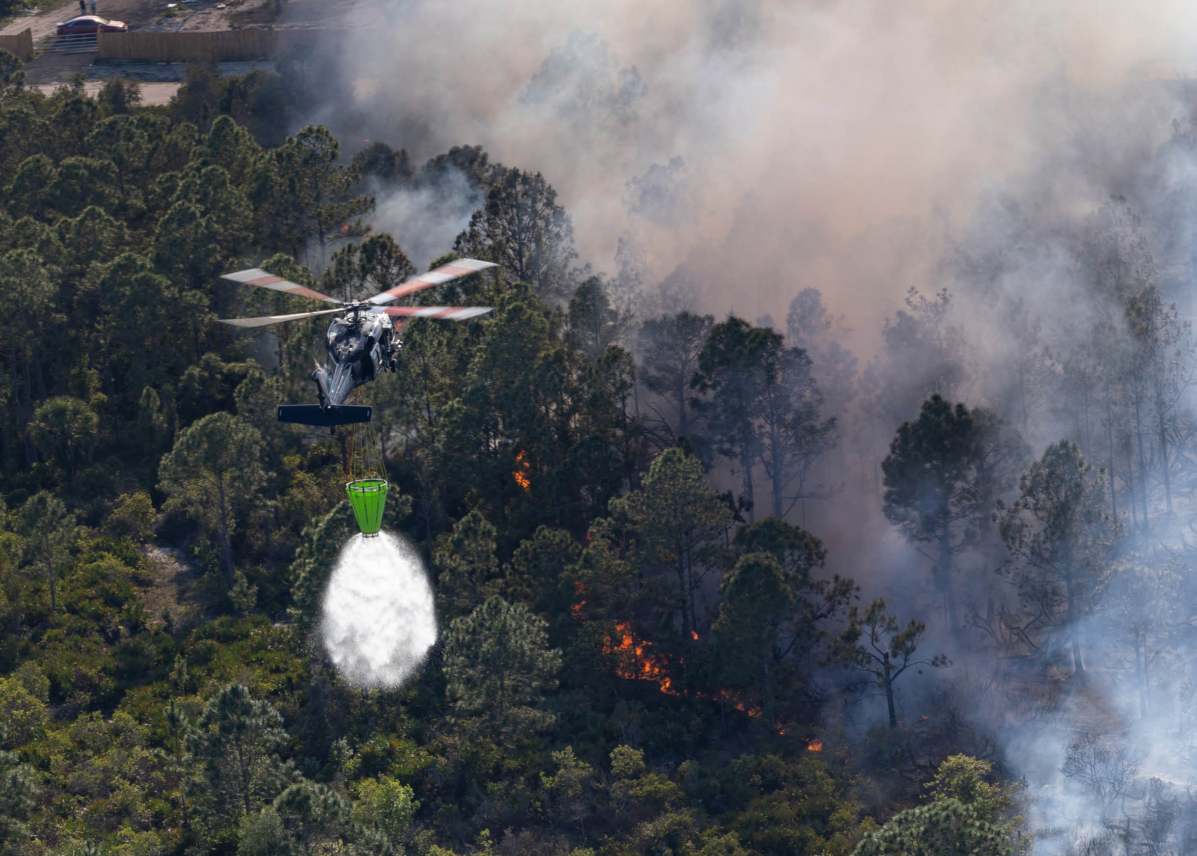 A helicopter is flying in the air. Description generated by AI