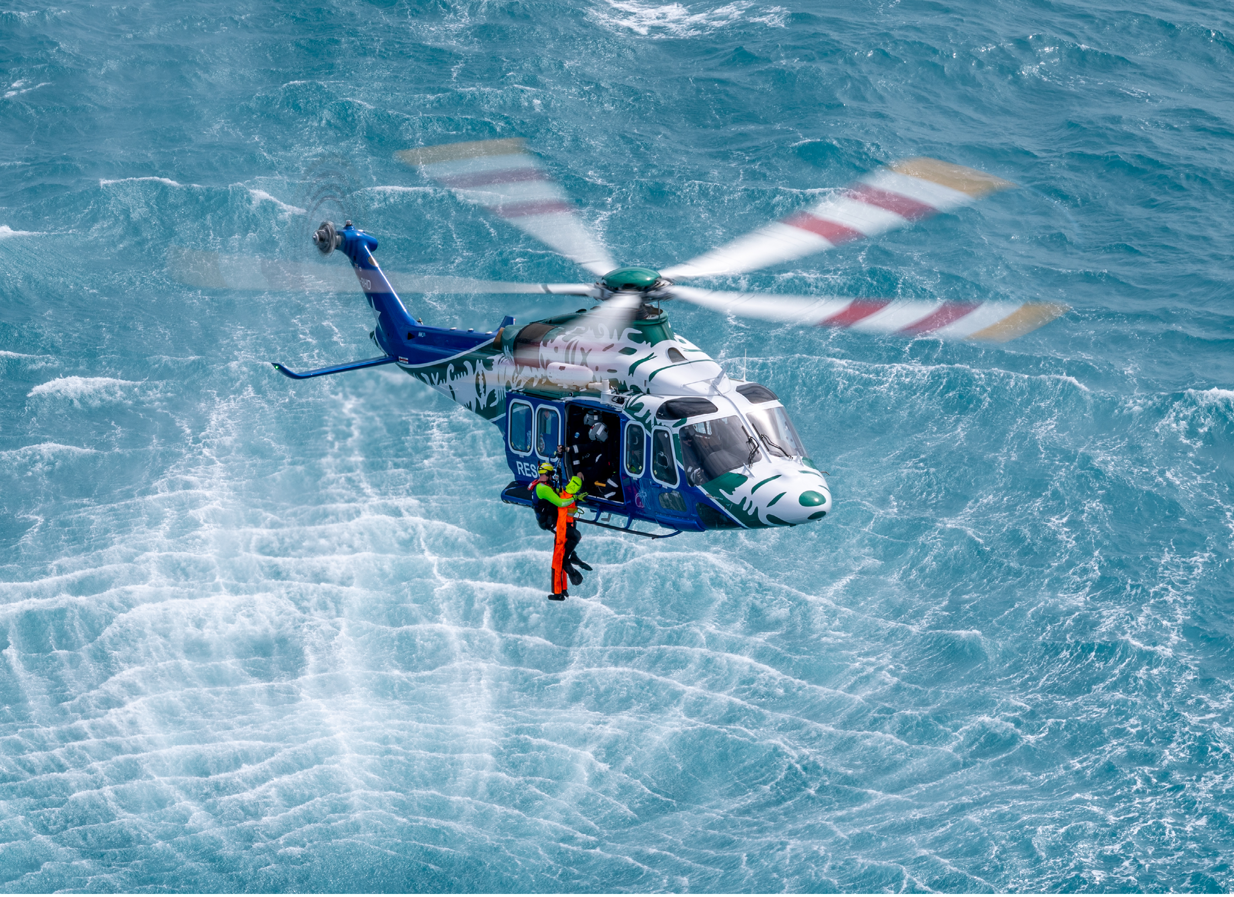 Two helicopters on a beach. Description generated by AI