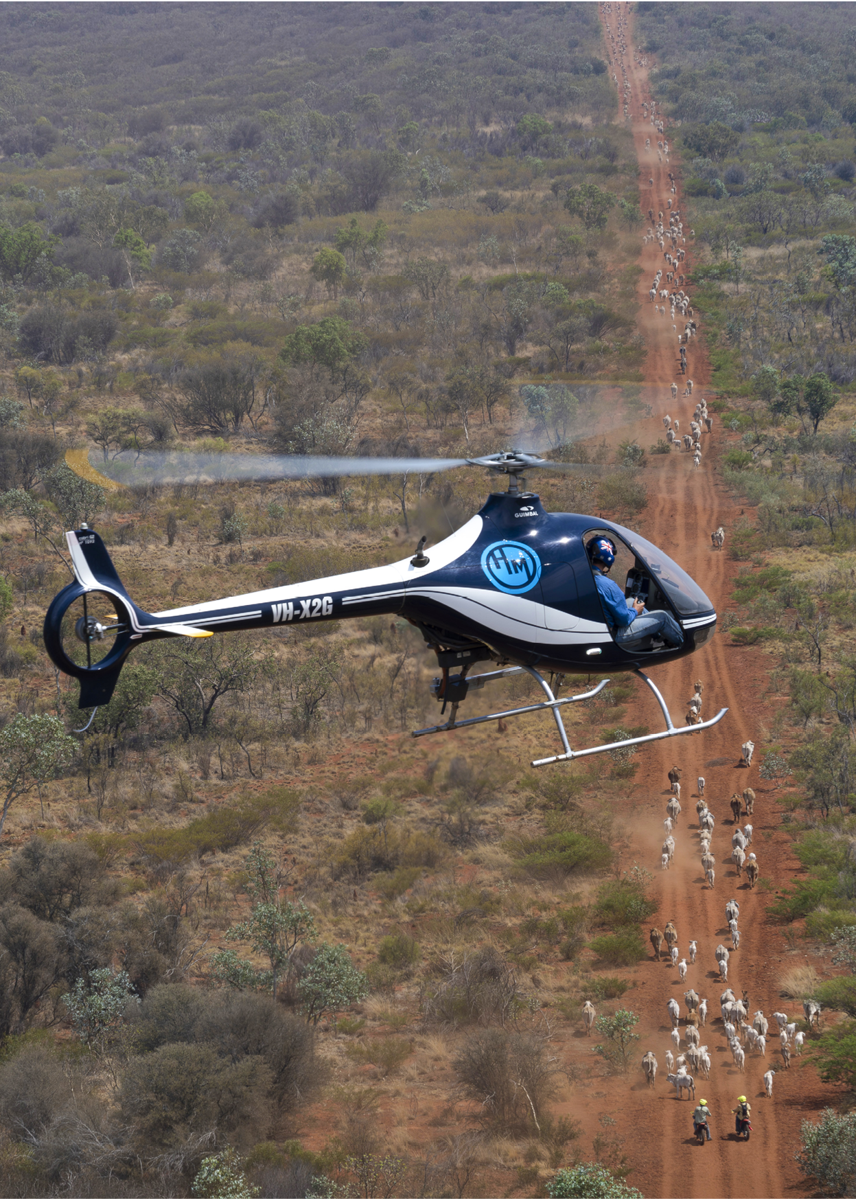 A helicopter flying in the air. Description generated by AI