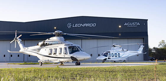 A yellow and red helicopter with the number 12 on it. Description generated by AI
