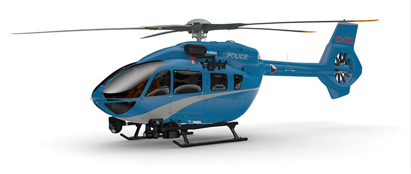 A red and white helicopter is parked on the side of a road. Description generated by AI