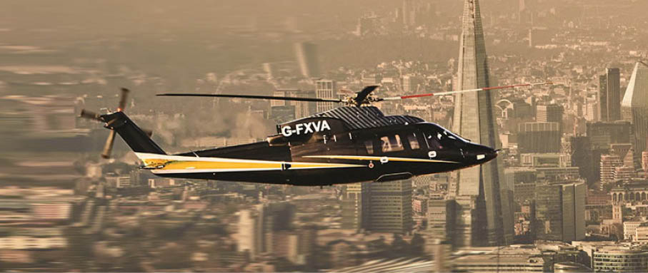 A helicopter is parked on a blue surface. Description generated by AI
