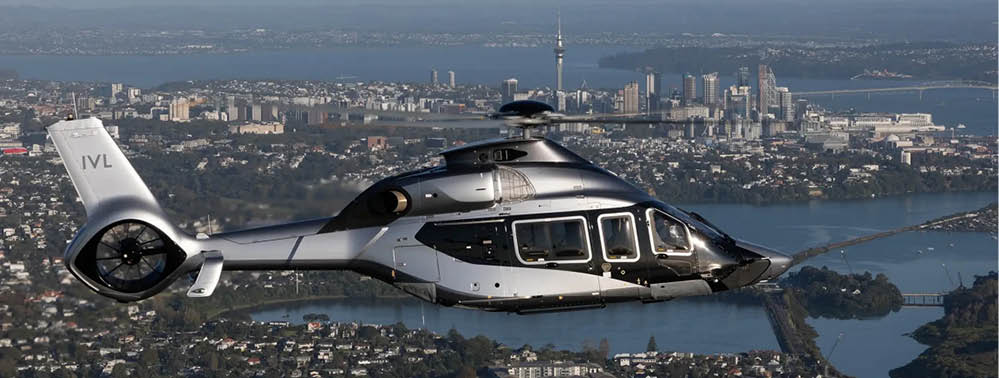 A green and black helicopter with the number 54 on it. Description generated by AI