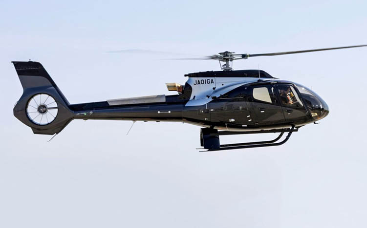 A helicopter with a red and black color scheme. Description generated by AI