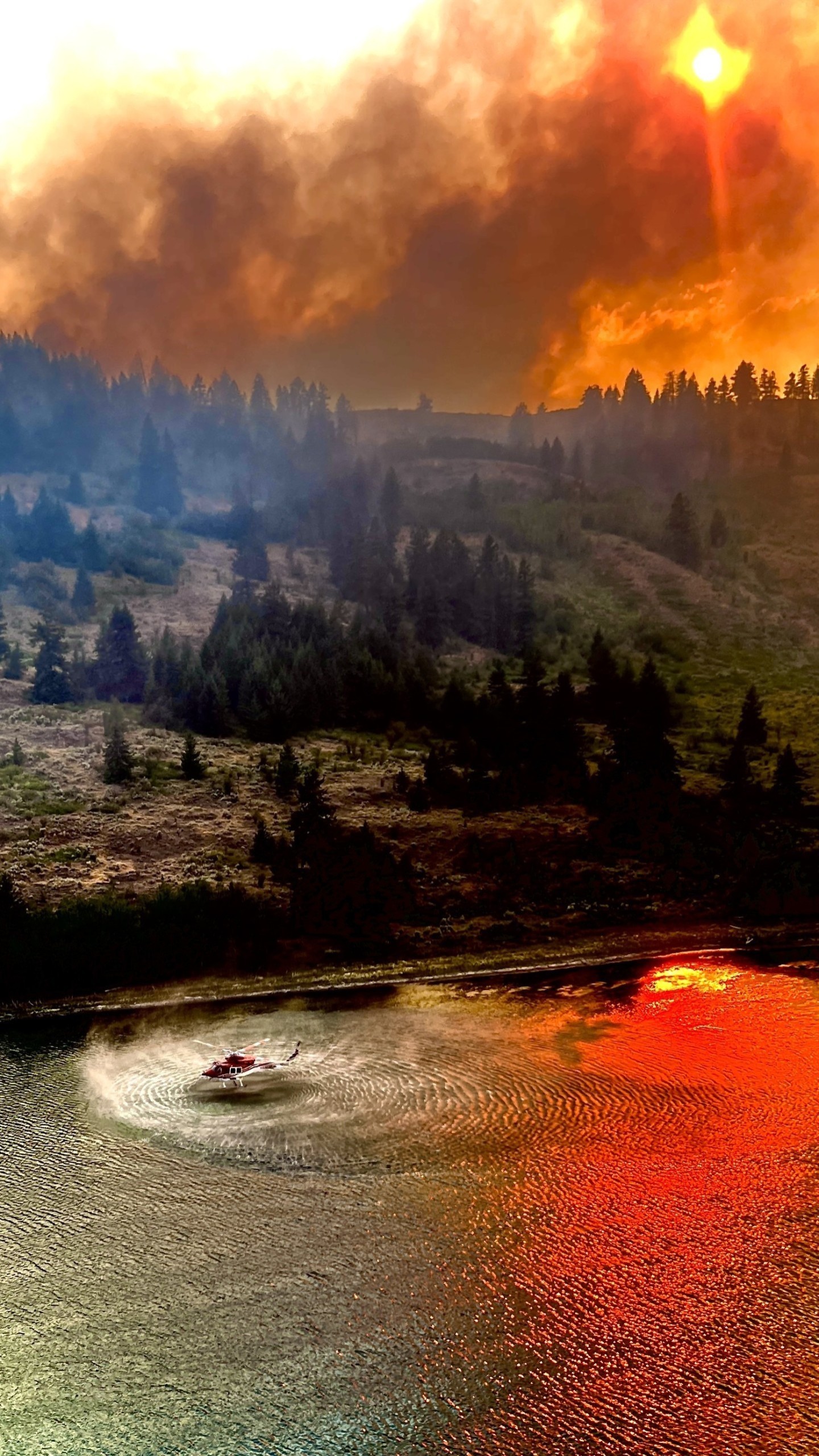 Photo was taken just outside of Osoyoos, BC this summer when they evacuated part of the town. Was just in a rotation for the dip site when
the photo was taken.