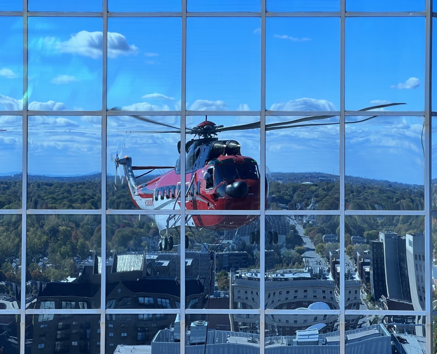 A CHI Inc S-61 reflects off the 5/3 financial center windows while changing out the sign on the 31st floor. The two signs were removed and
replaced in halves plus the new canvas for a total of 5 lifts.