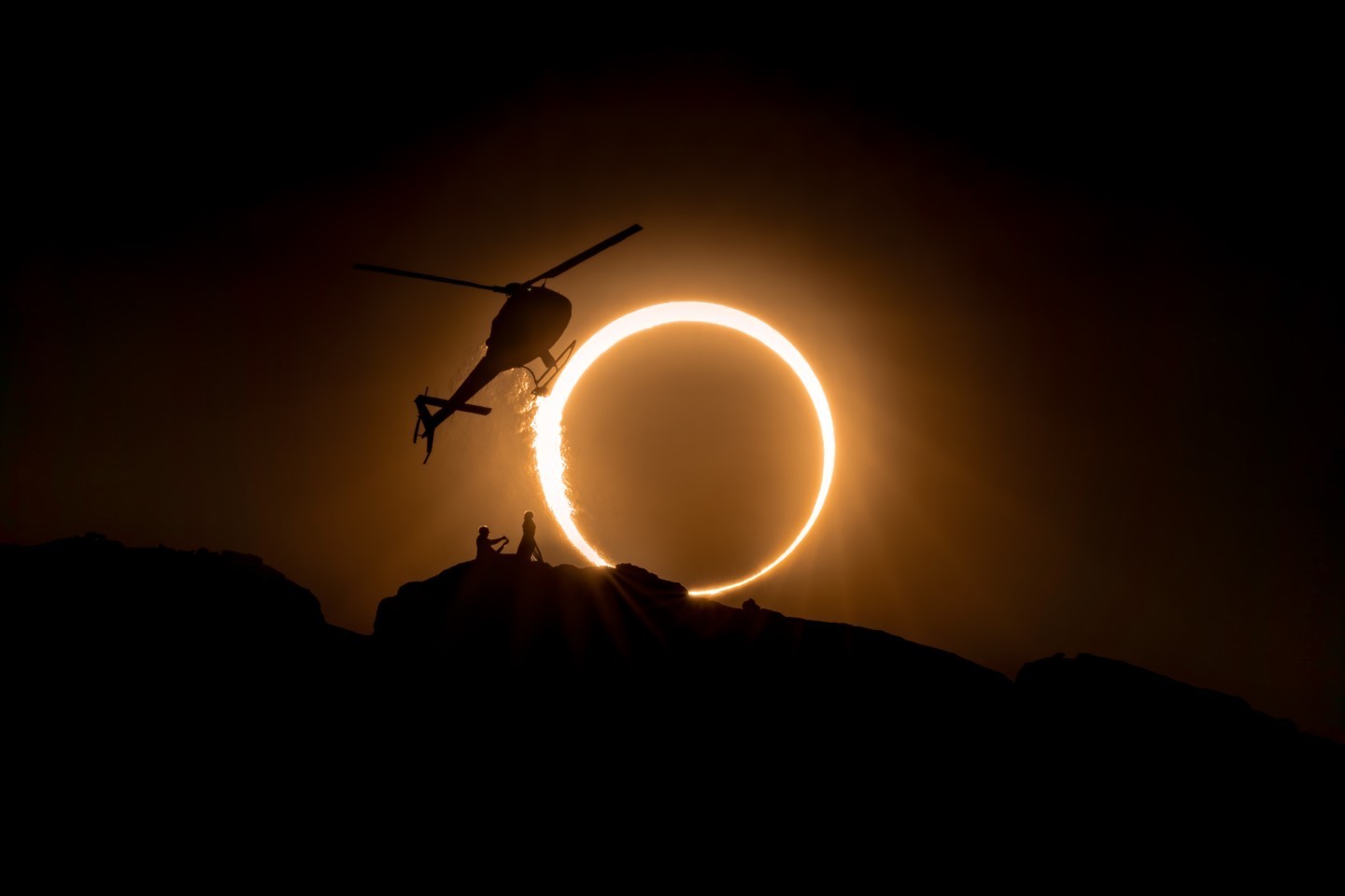 Dreams coming true as helicopter pilot Jeff Mullen proposes to fixed wing pilot Bethaney Lewis in front of October's annular solar eclipse.
After dropping them off, Joe Metzger watches in Voodoo Air's Astar from a half mile away.