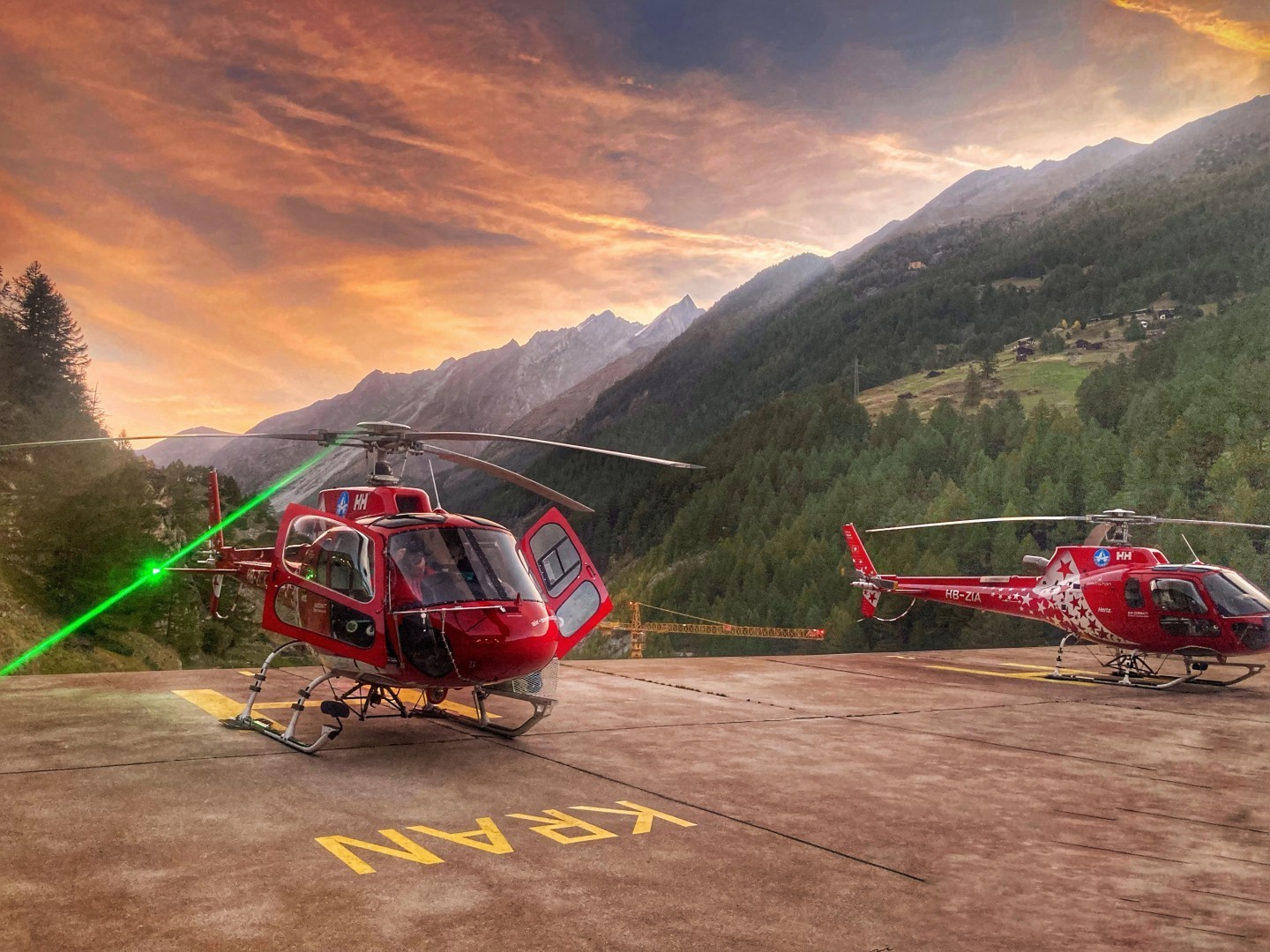 Two airbushelicopters h125 are ready in a wonferful sunrise morning to do some arial work in the region of zermatt next to rhe famous
mountain the matterhorn