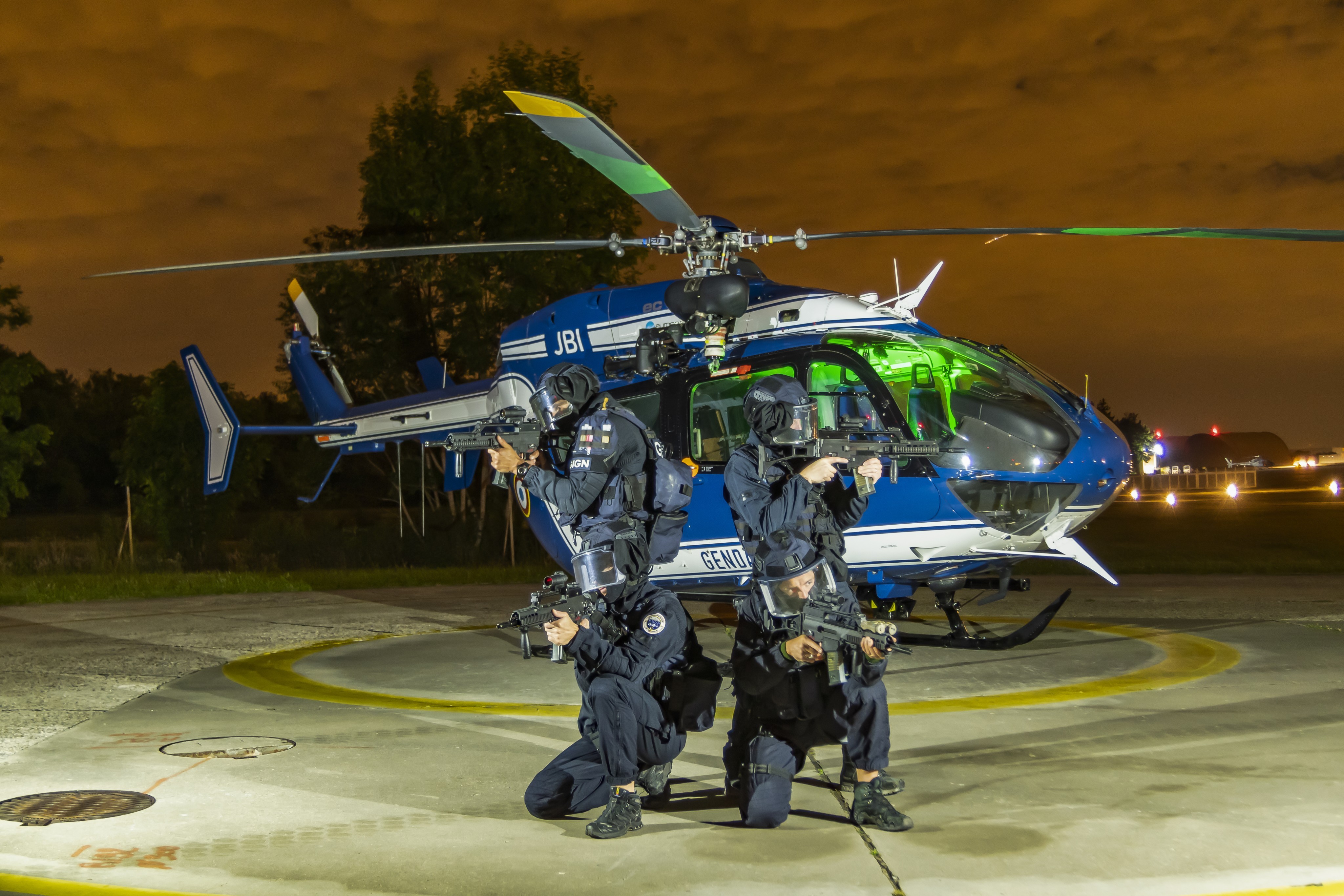The Special Forces of the French police (GIGN) posing in front of the Airbus EC135 of the Gendarmerie Air Forces (CFAGN) after the night
training near Paris.