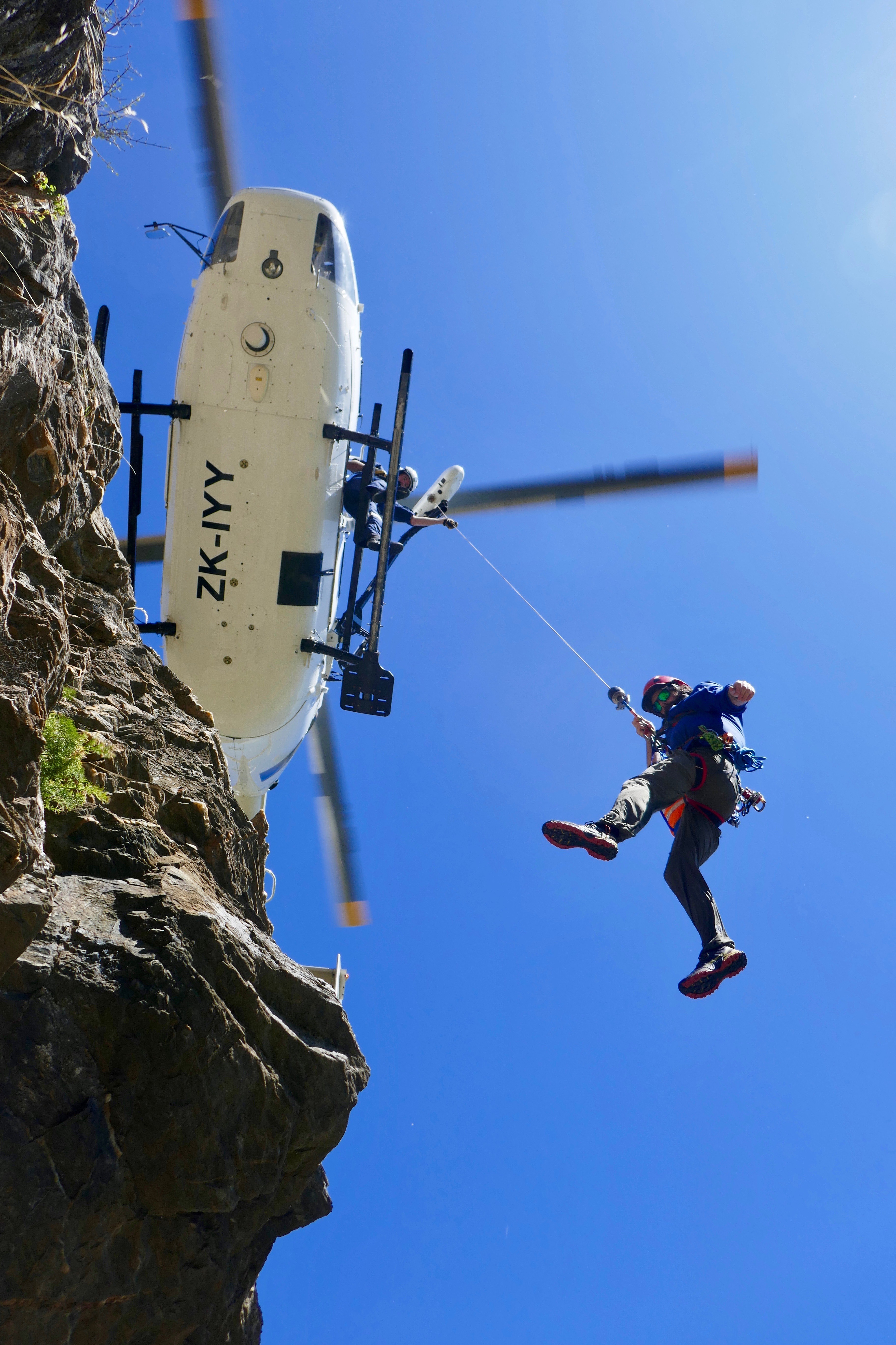 Niall Mclean on the winch line from the Southern Lakes Helicopters BK117, during winch training with Richie Hunter operating the winch
during Queenstown Alpine Cliff Rescue training at Jacks Point in Queenstown