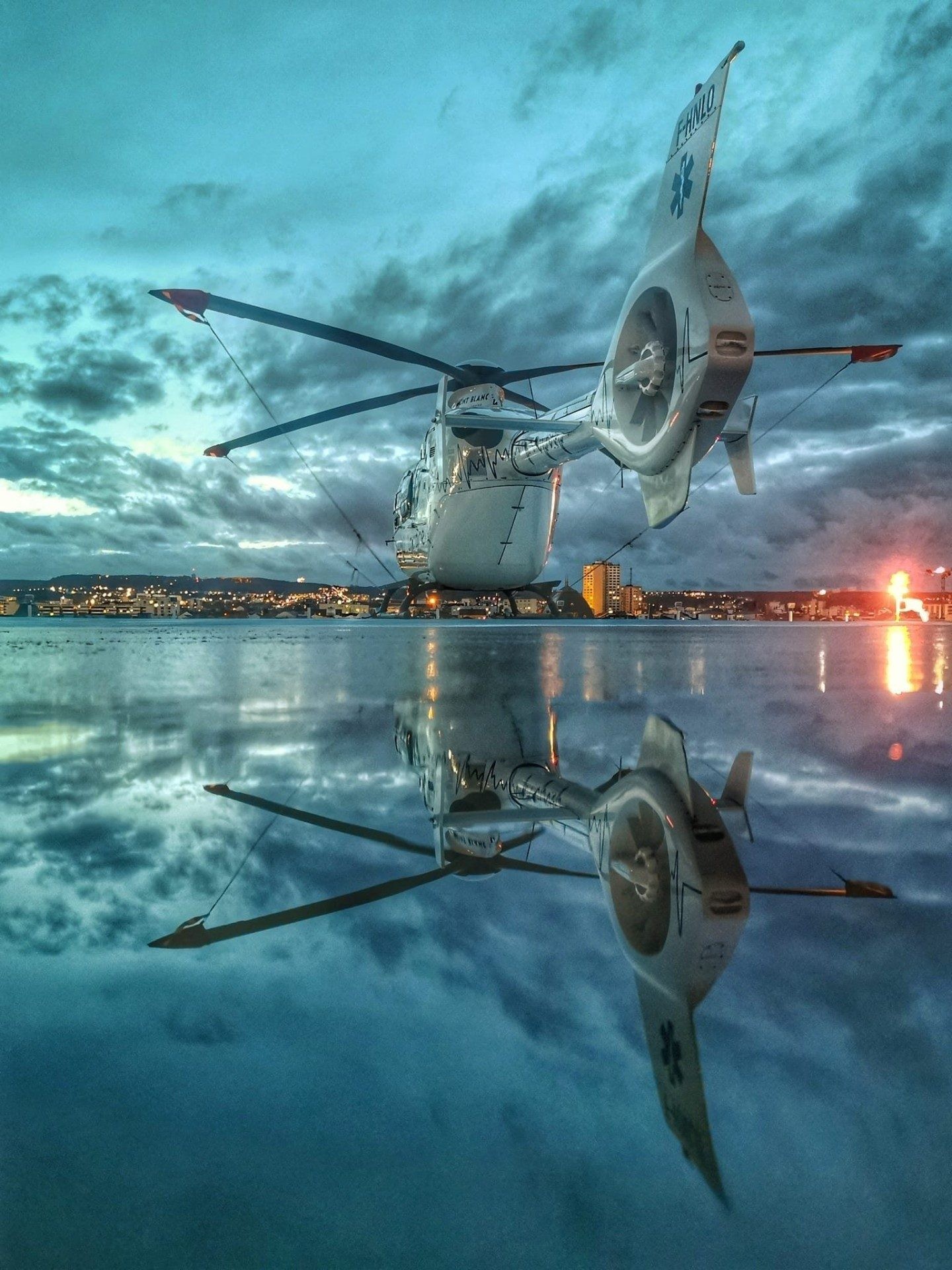 EC135T2+ Helicopter<br />
F-HNLO SAMU LORRAINE<br />
Mont Blanc helicopters company<br />
<br />
Just before the Franklin storm.<br />
The soaked ground of the FATO allowed me this mirror effect! For the colours ... luck at the right time!<br />
On the roof of the central hospital in Nancy France