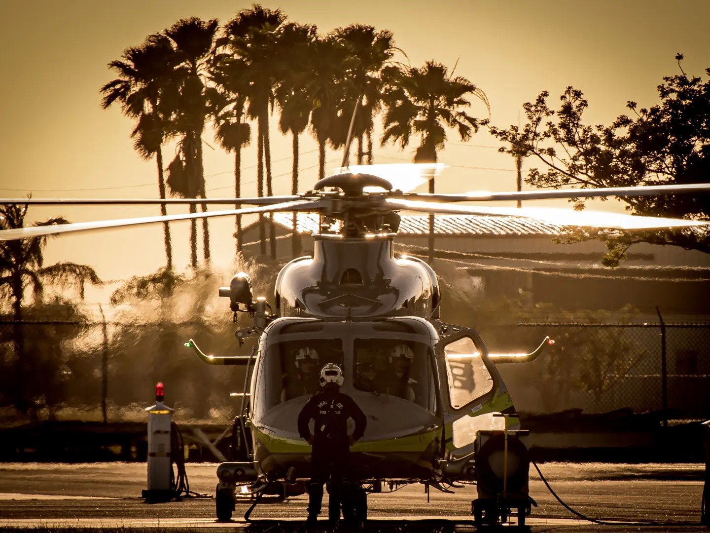 Miami Dade Fire Rescue's Air Rescue 2, is pictured here at the Southern District Air Station in Tamiami Airport, getting prepped to depart
to conduct observation operations on a brush Fire nearby.