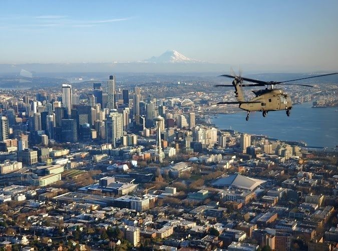 My company, C Co CrazyHawks 2-158AHB, was selected to fly the Chairman of the Joint Chief of Staff General Mark Milley and his staff around
western Washington. We departed Joint Base Lewis-McChord and took him to a naval submarine station north of Seattle for a conference. After
the conference we gave him a scenic tour of Seattle. That is when I took the picture of the aircraft he was in as we approached the Space
Needle.
