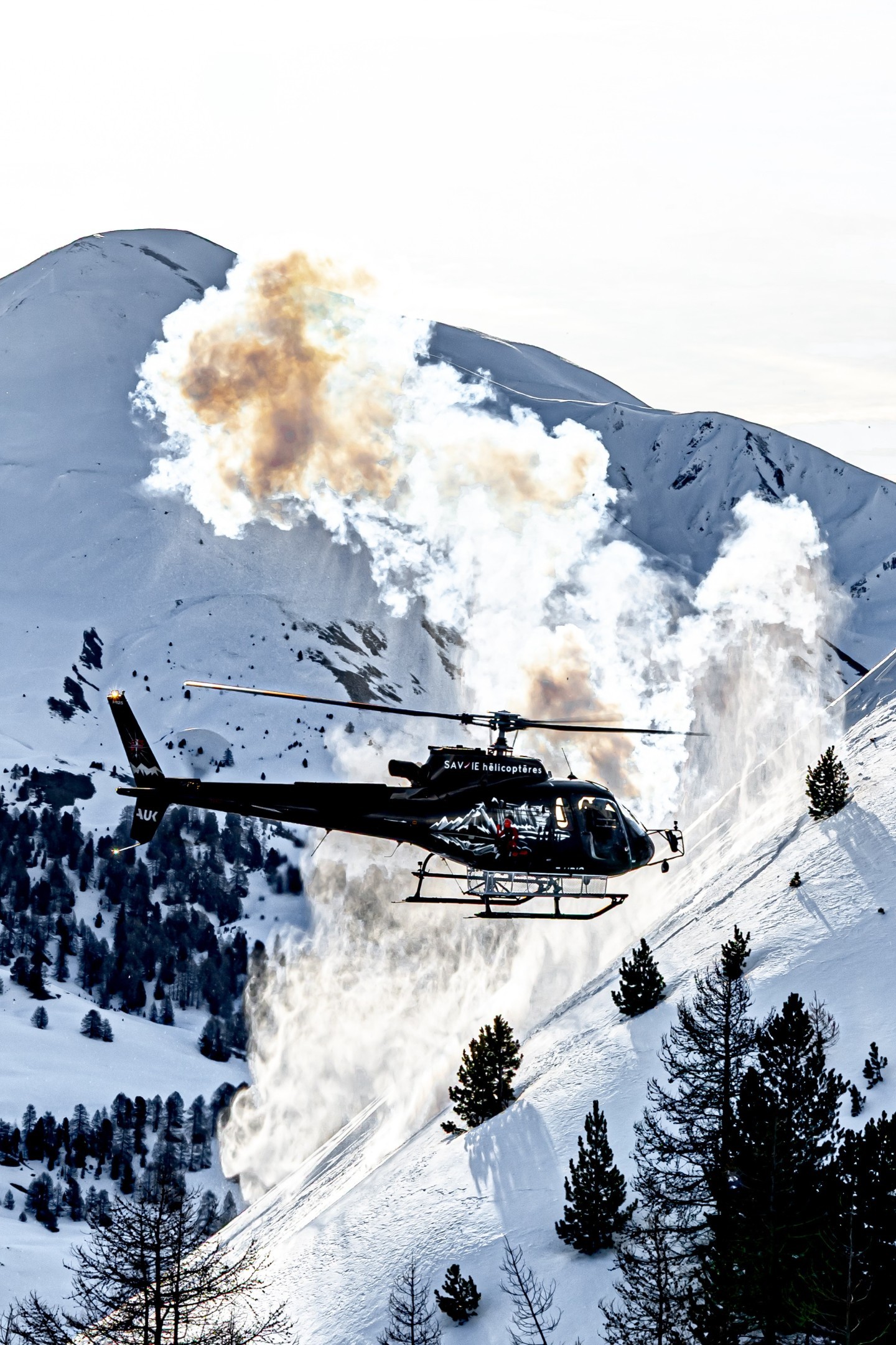I captured this H125 from Savoie Hélicoptères during an air-to-air shoot. We're in the French Alps during a mission to trigger avalanches using dynamite launched from the chopper. The day before the shoot, snow had fallen and the wind had picked up, so accumulations of blown snow created this magnificent cloud of powder.