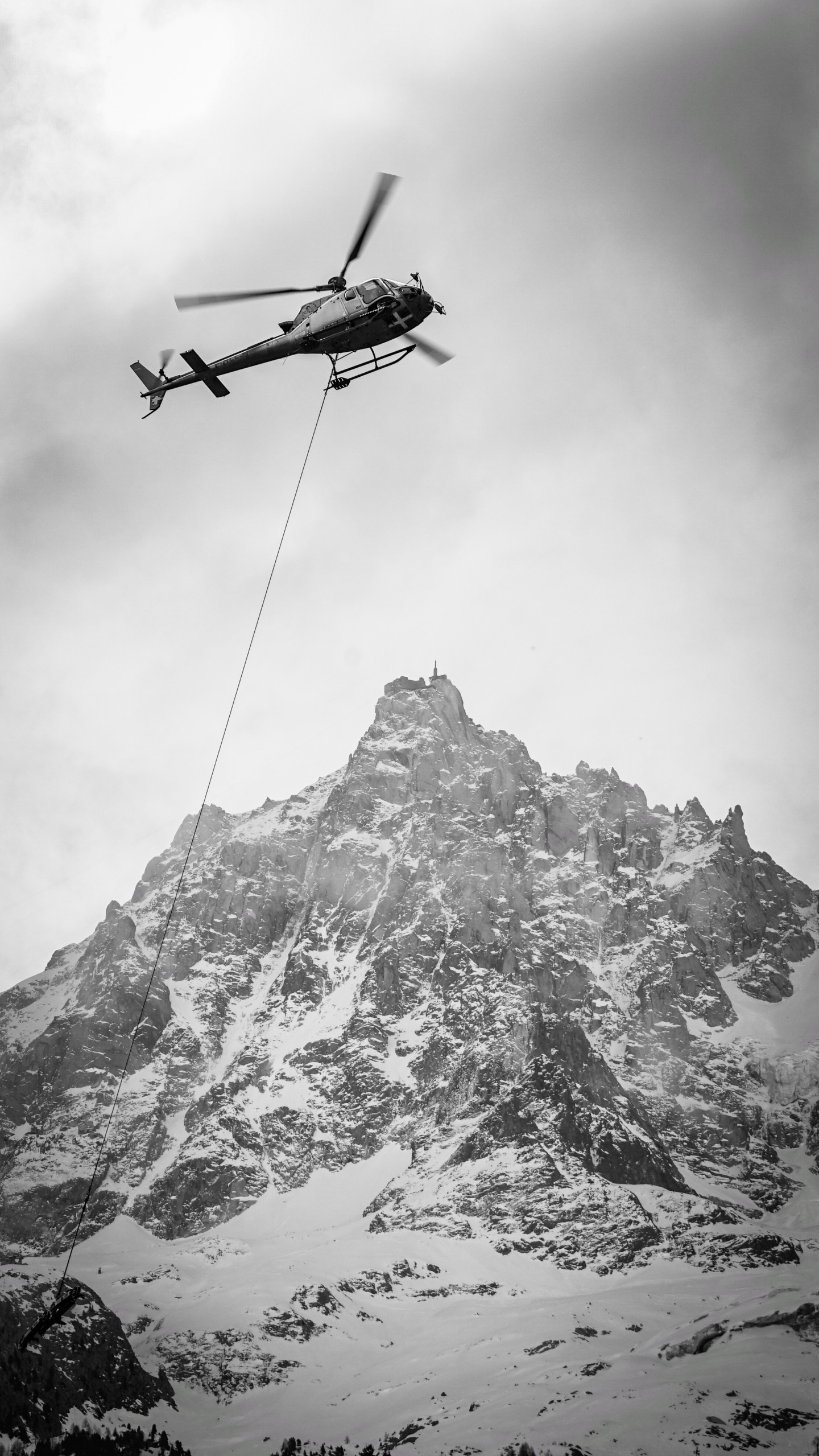 Chamonix Mont-Blanc Helicoptere H125 + The Aiguille du Midi in the background + the cloudy atmosphere= that a special moment !