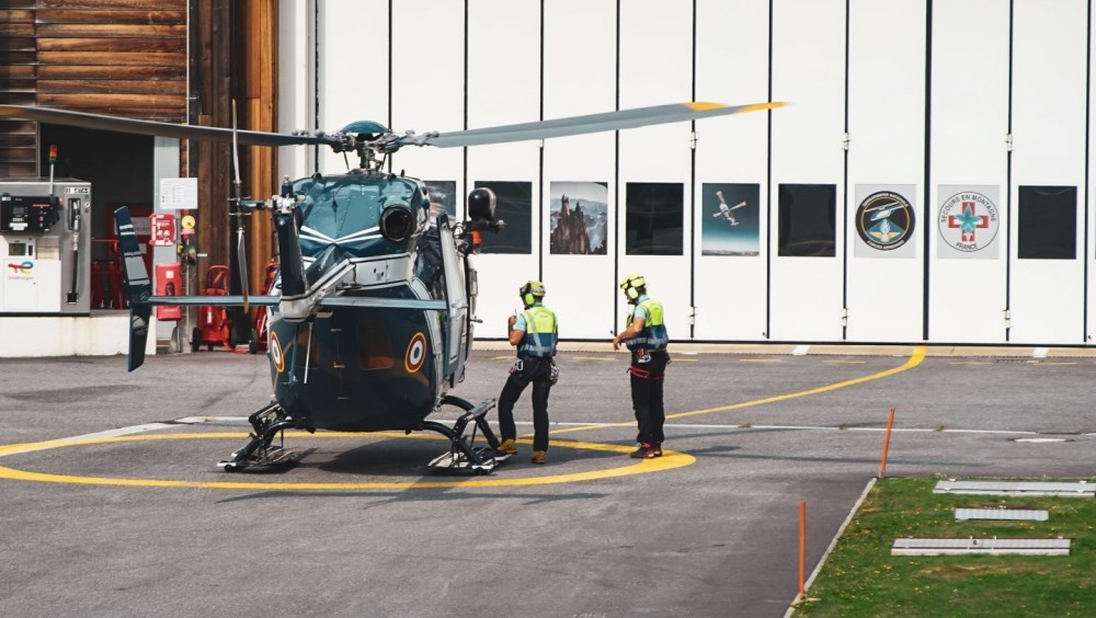 Two rescuers alongside Choucas 73, called in as reinforcement in the Chamonix valley, ready to head out on a mission.
