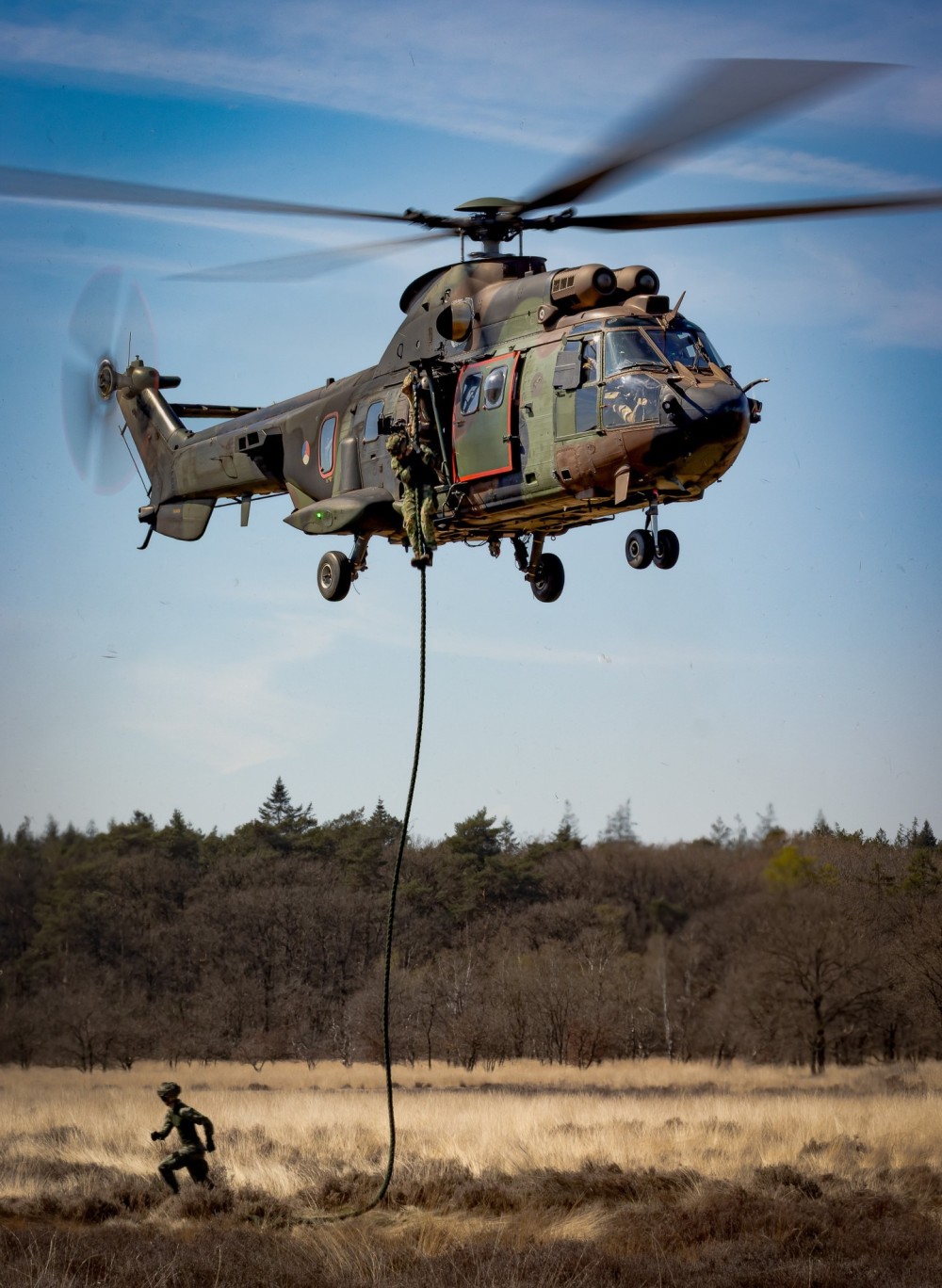 a Cougar As532 Helicopter Flying by the 300 Squadron (Wildcats) based on Gilze-Rijen Air Base
during a Fast-rope Training (Korps Mariniers) in beautiful weather