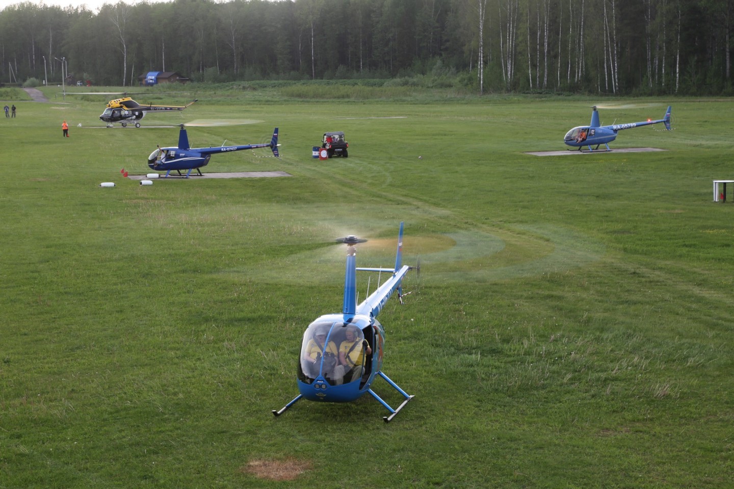 Helicopter sport stadium in work. Russian Cup - 2025 competition, Konakovo airfield, Tverskoy region. Robinson 44 and "smallest" Soviet/Russian sports helicopter Mil Mi-2/ Summer 2025