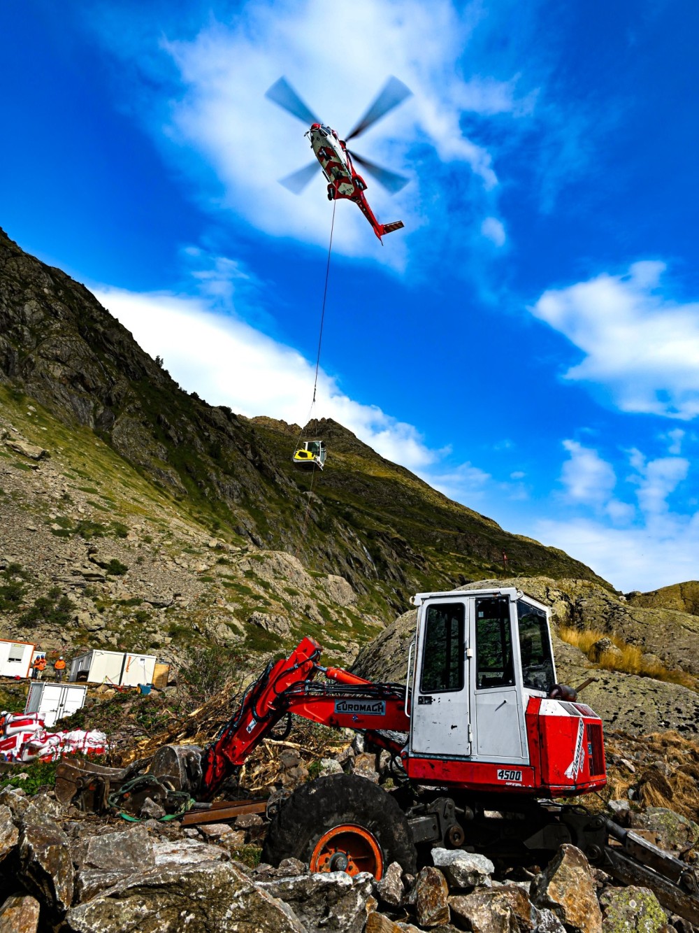 I captured this H215 from Heliswiss during a mountain construction site in the French Alps. The goal was to transport two spider excavators, the heaviest load being about 3 tons. I found that placing the spider excavator in the foreground with the H215 behind, provided proof that the helicopter should be considered a construction machine.